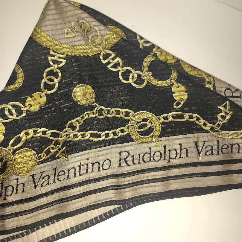 This is a Rudolph Valentino silk scarf with a black and gold chain pattern. #11