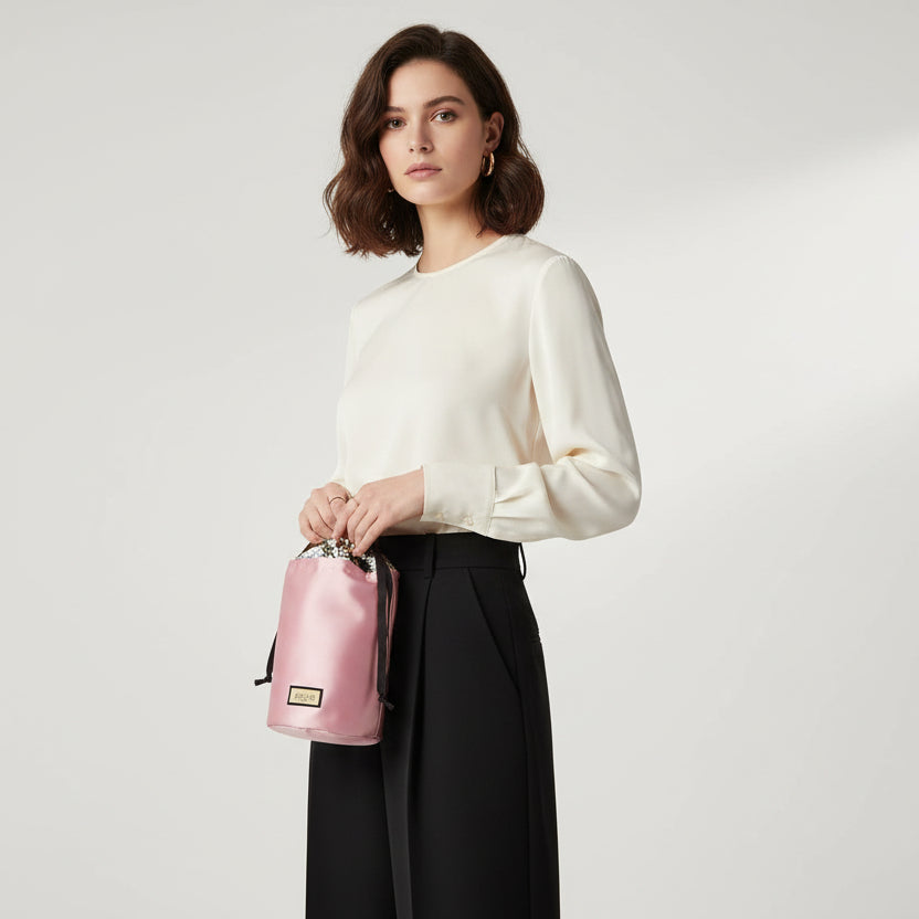 Gucci Beauty Novelty small drawstring pouch in pink satin with a floral interior lining.  GWP