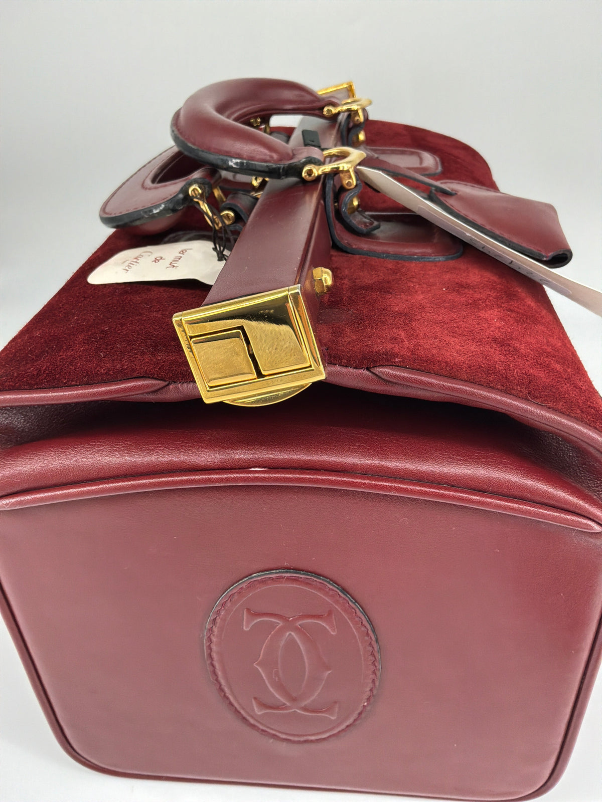 House of Melton vintage Les Must de Cartier bordeaux suede and leather doctor bag with gold hardware and original tag