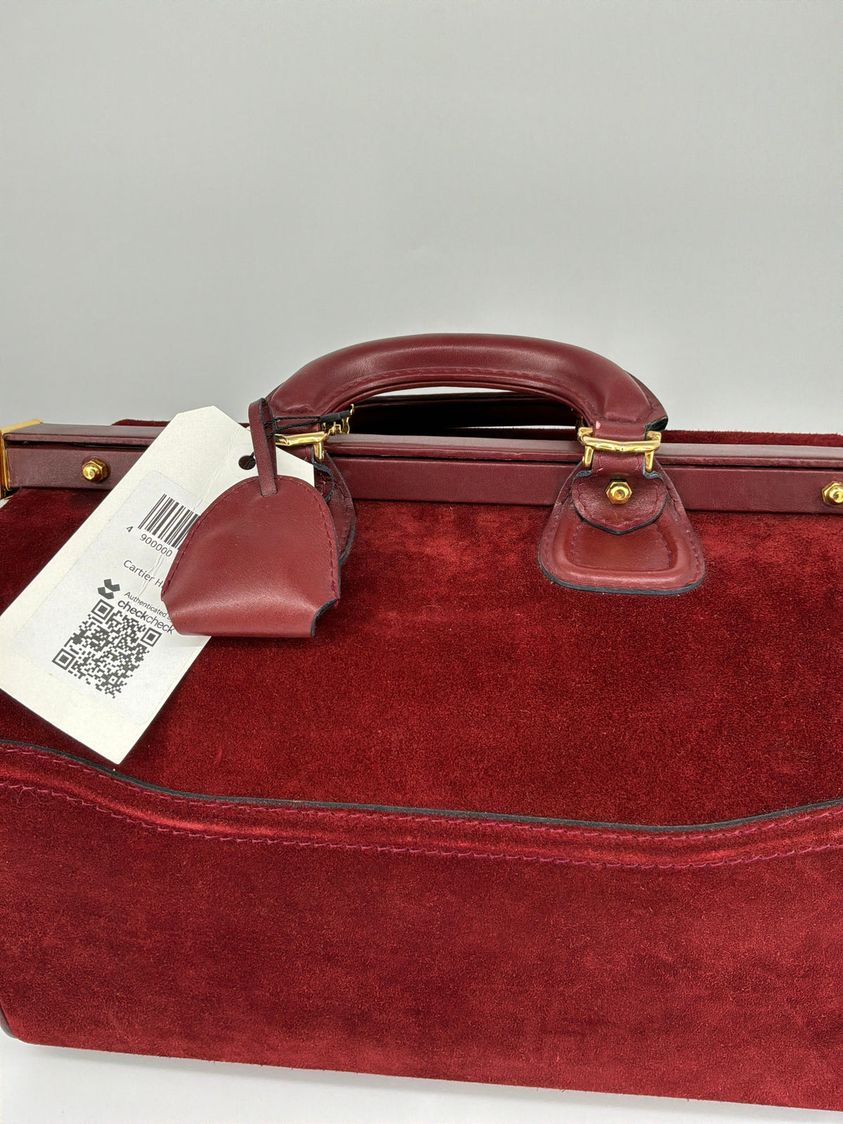 House of Melton vintage Les Must de Cartier bordeaux suede doctor travel bag with gold hardware and original tag