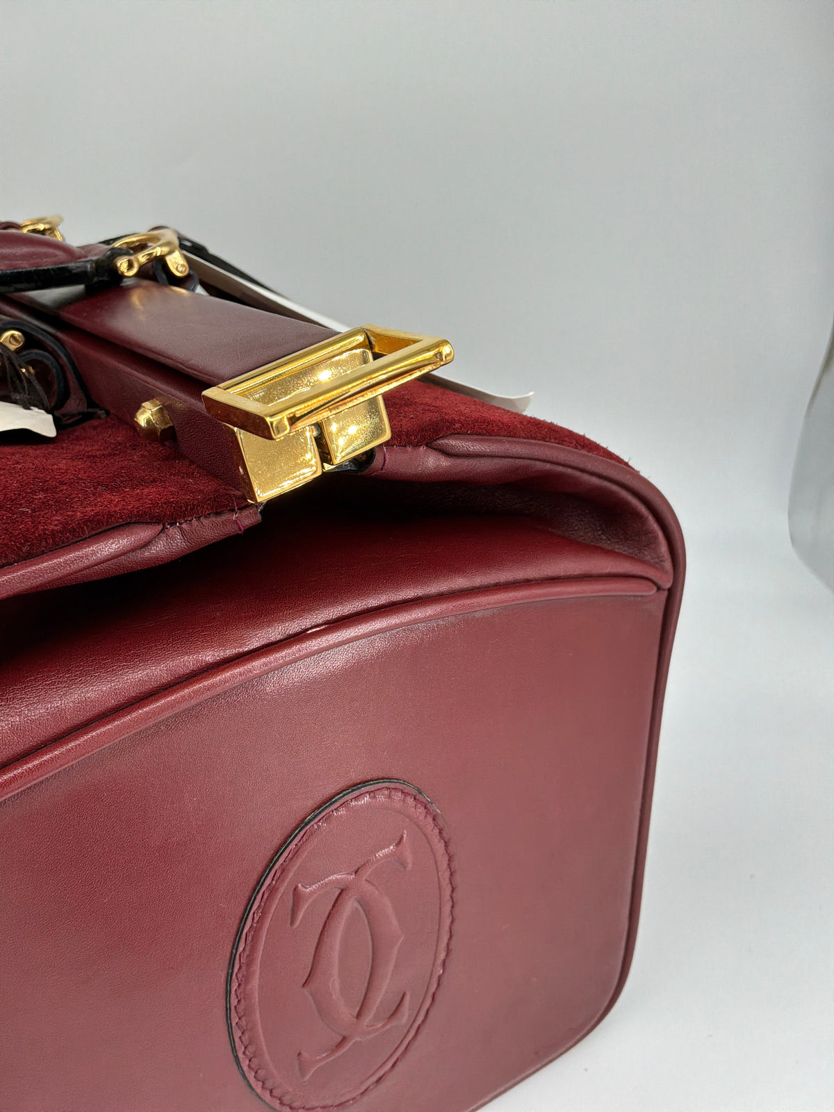 House of Melton vintage Les Must de Cartier bordeaux suede and leather doctor bag with polished gold-tone latch