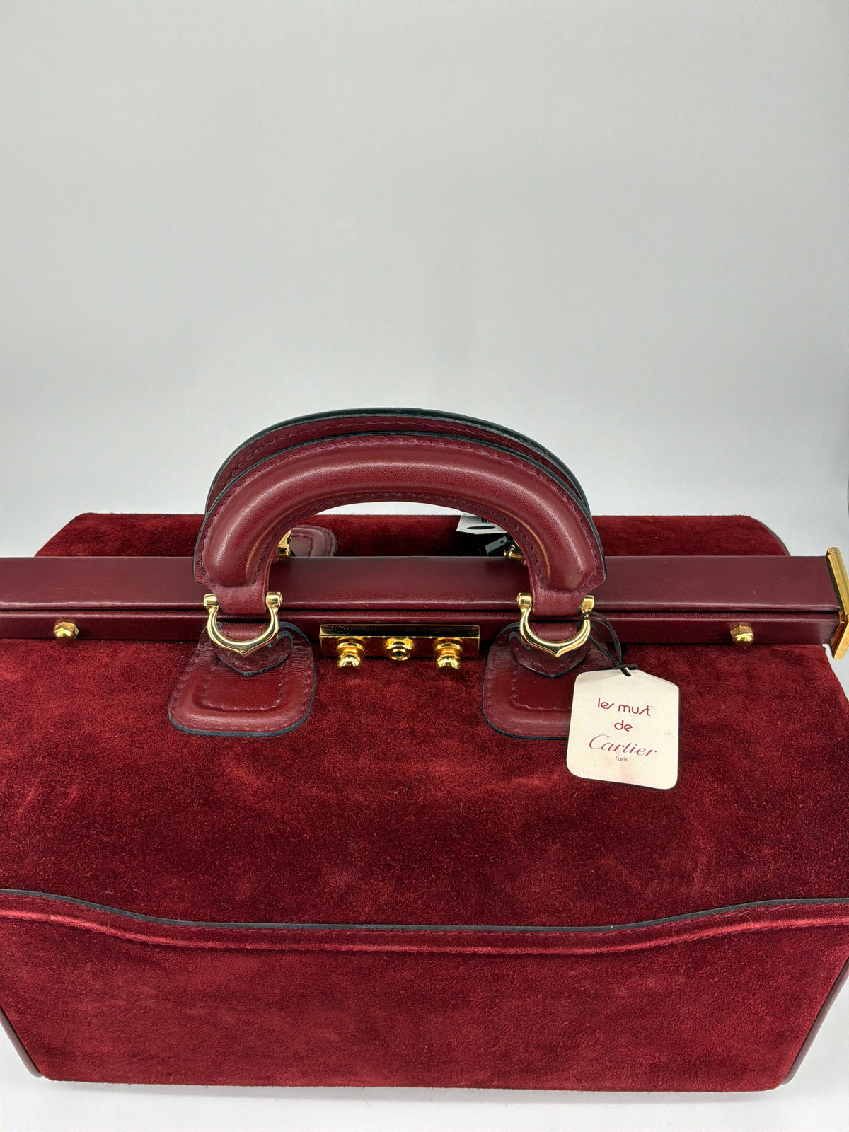 House of Melton vintage Les Must de Cartier bordeaux suede doctor travel bag with gold hardware and original tag